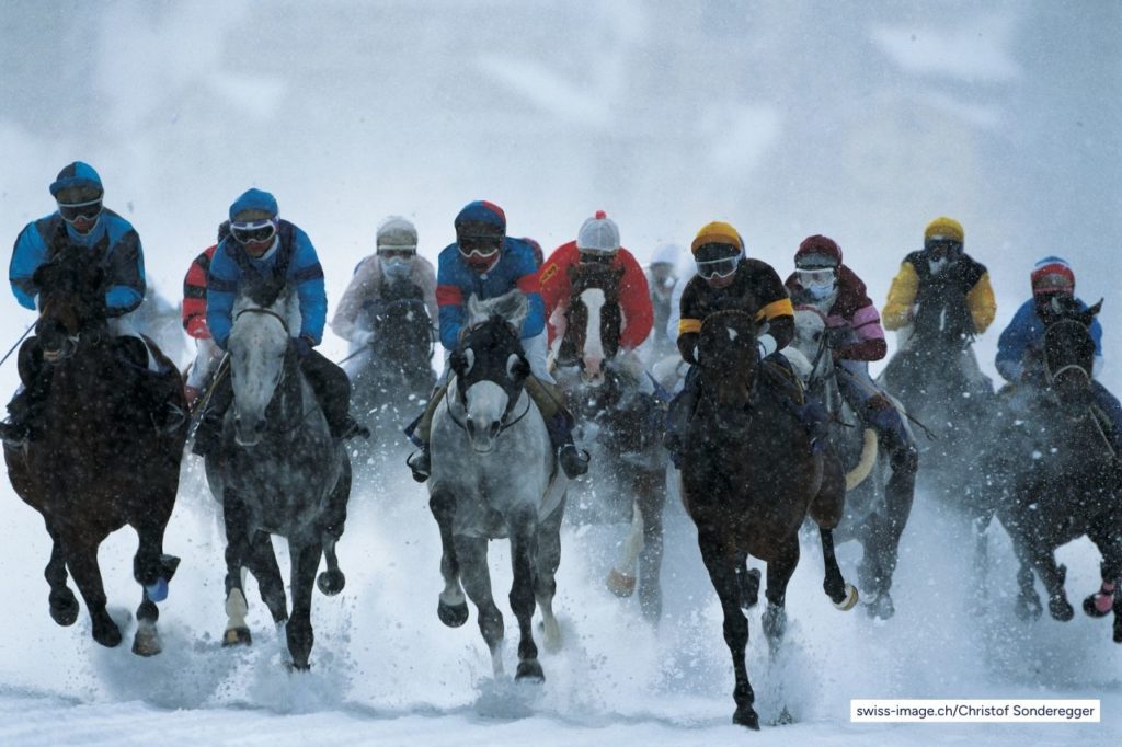 Horses racing on ice at White Turf festival in St Moritz