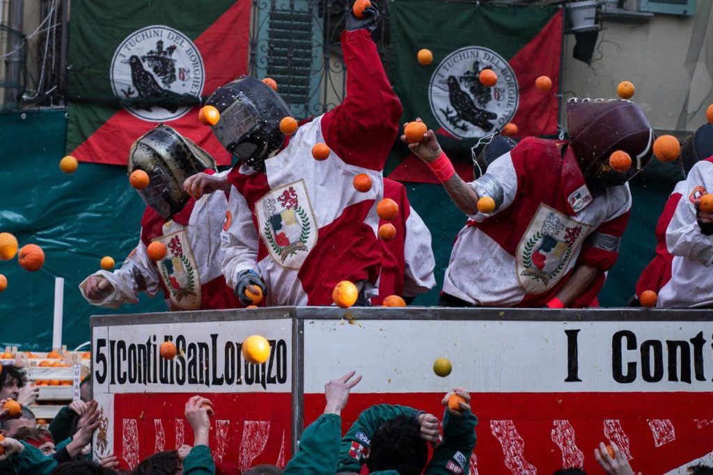 People in battle of the oranges at a festival in Ivrea Italy